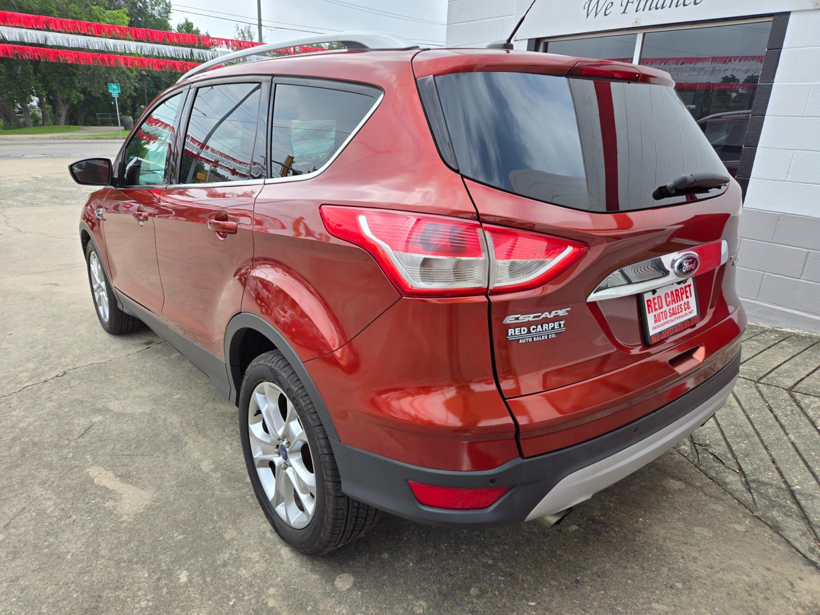 2014 Orange Ford Escape Titanium 4WD (1FMCU9JX7EU) with an 1.6L L4 DOHC 16V engine, 6-Speed Automatic transmission, located at 503 West Court, Seguin, TX, 78155, (830) 379-3373, 29.568621, -97.969803 - 2014 Ford Escape Titanium 4WD with a 1.6L L4 DOHC 16V, Automatic, Tilt, Cruise, AM/FM/CD Touchscreen Stereo, Power Windows, Locks, Seat and Side Mirrors, Leather Seating, Bluetooth, Dual Climate Control, Rear A/C, Rear Camera, Bumper Sensors, Alloy Wheels, Rear Defroster, Rear Wiper and more!! - Photo #3